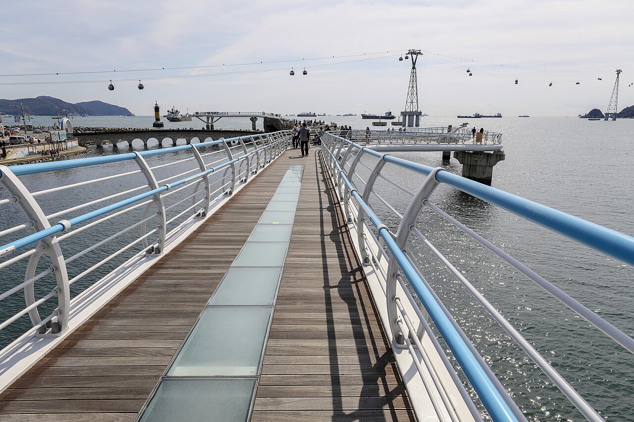 Songdo Cloud Trails walkway with cable cars crossing the sea behind it