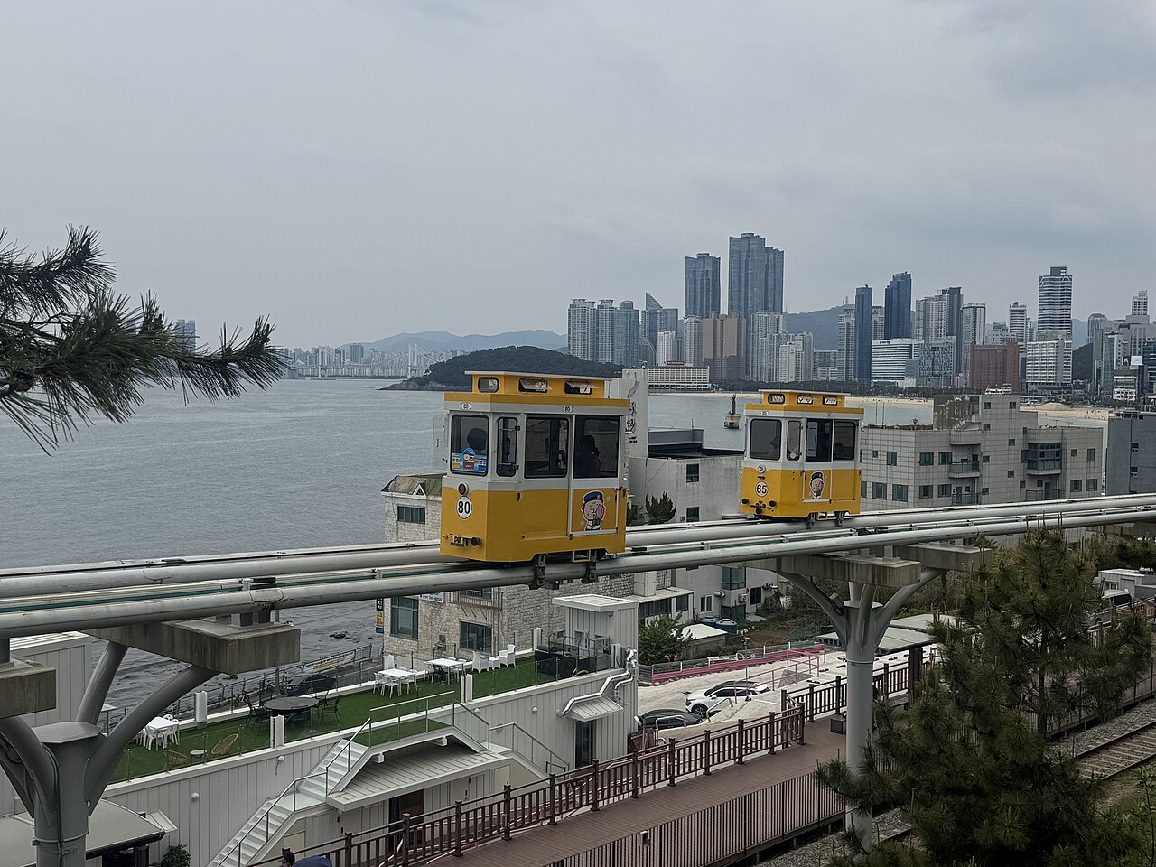 Sky Capsules running on elevated rails beside the Haeundae coast